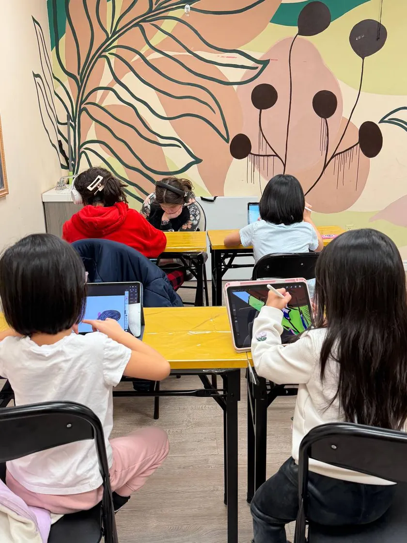 Students drawing on iPads in a digital art class at Oxford Art Academy