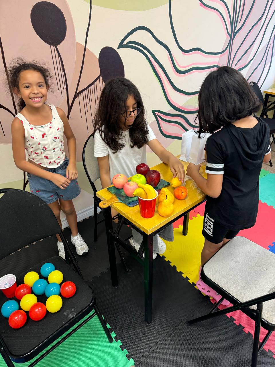 Campers setting up a still life of fruit to draw at weekend art camp in Richmond Hill